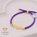 دستبند بافت و طلا قلب و پر