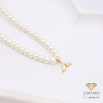 گردنبند مرواریدی با پلاک دم وال